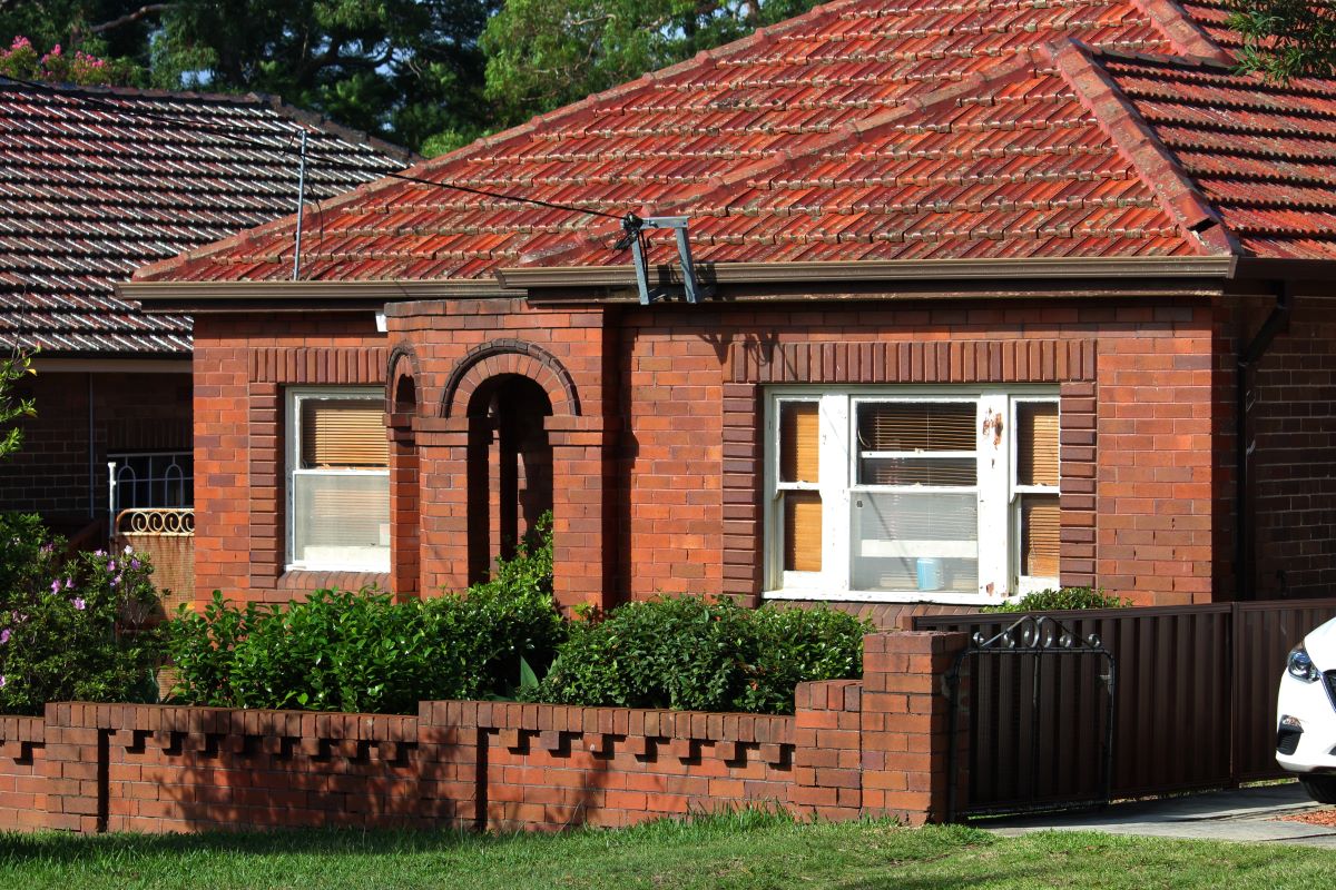 historic clinker brick house with arched brick entrance and decorative brickwork. sydney, australia